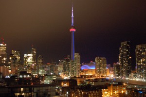 The CN Tower standing out against the night sky, viewed from the Thompson Hotel Rooftop Lounge Credit: Julie Kalan