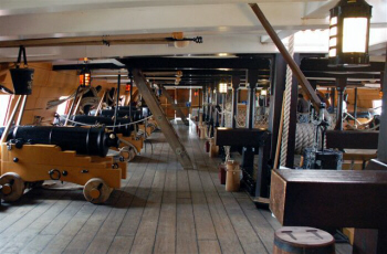 A line of cannons running along the HMS Victory's Lower Gun Deck