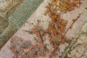 One of the many jobbers' marks carved into the stones of the West Terrace. 