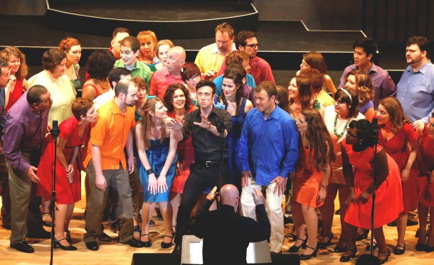 Chris Barillaro (in black) surrounded by the cast of Lyric Singers 