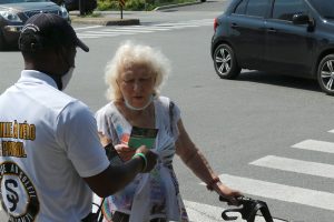 Crime Prevention - Sun Youth Bike Patroler assisting a senior citizen