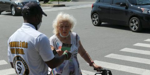 Crime Prevention - Sun Youth Bike Patroler assisting a senior citizen