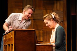 Tess Benger as Carole King (seated at the piano) and Darren Martens in the role of Gerry Goffin