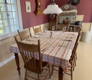 The dining room is decorated with rural-styled furniture in the spirit of its 1862 roots