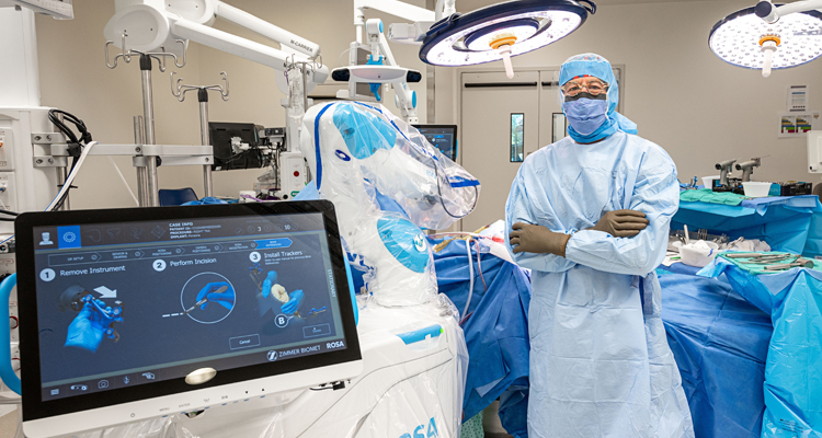 State-Of-The-Art Orthopedic Surgery At The JGH Changes Lives - The JGH’s Dr. David Zukor, all suited up to perform knee surgery with the latest donor-supported technology.