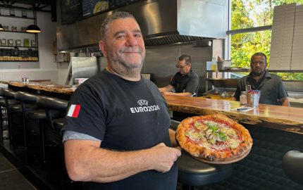 Lillo showcases one of his popular pizzas