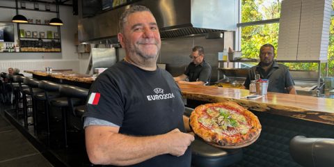 Lillo showcases one of his popular pizzas