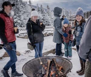 enjoy hot beverages in front of a blazing fire pit