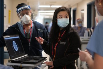 Stroke neurologist Dr. Amy Yu, centre, confers with colleagues about brain imaging at Sunnybrook in Toronto. Dr. Yu leads StrokeGoRed, a national network of research excellence.