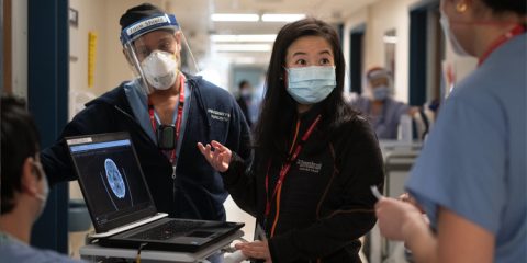 Stroke neurologist Dr. Amy Yu, centre, confers with colleagues about brain imaging at Sunnybrook in Toronto. Dr. Yu leads StrokeGoRed, a national network of research excellence.