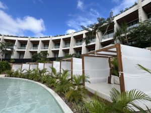 Loungers and Bali beds surround the serene pools, offering a peaceful retreat 